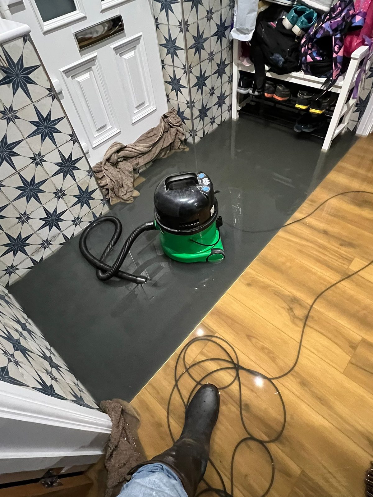 Water wall to wall across the ground floor — second flood September 2024