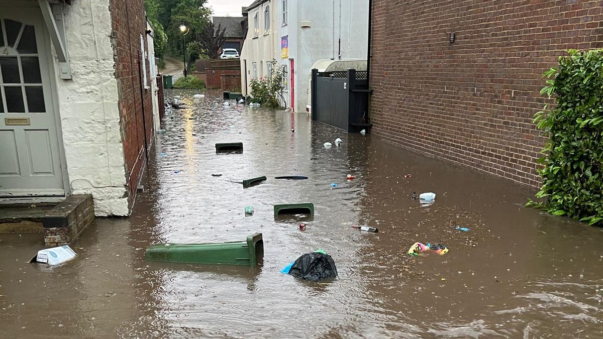 A village lane in Buckinghamshire under floodwater after heavy rain in 2023