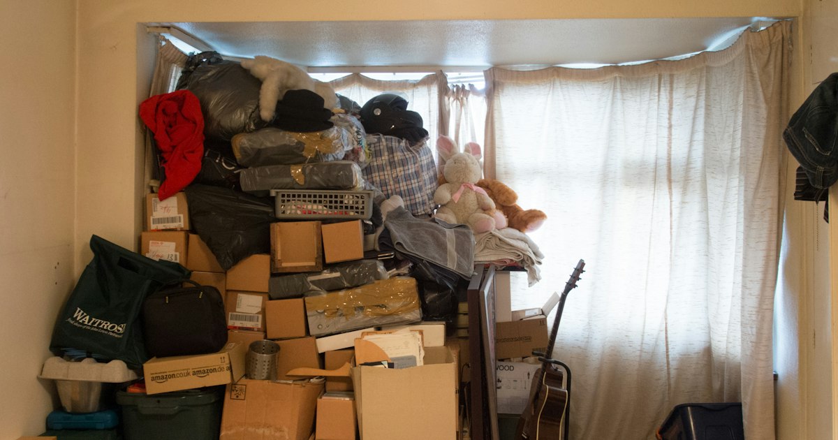 Room piled with boxed-up belongings