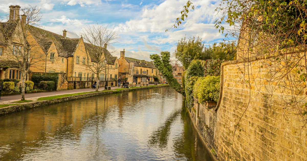 Stone village street beside a river